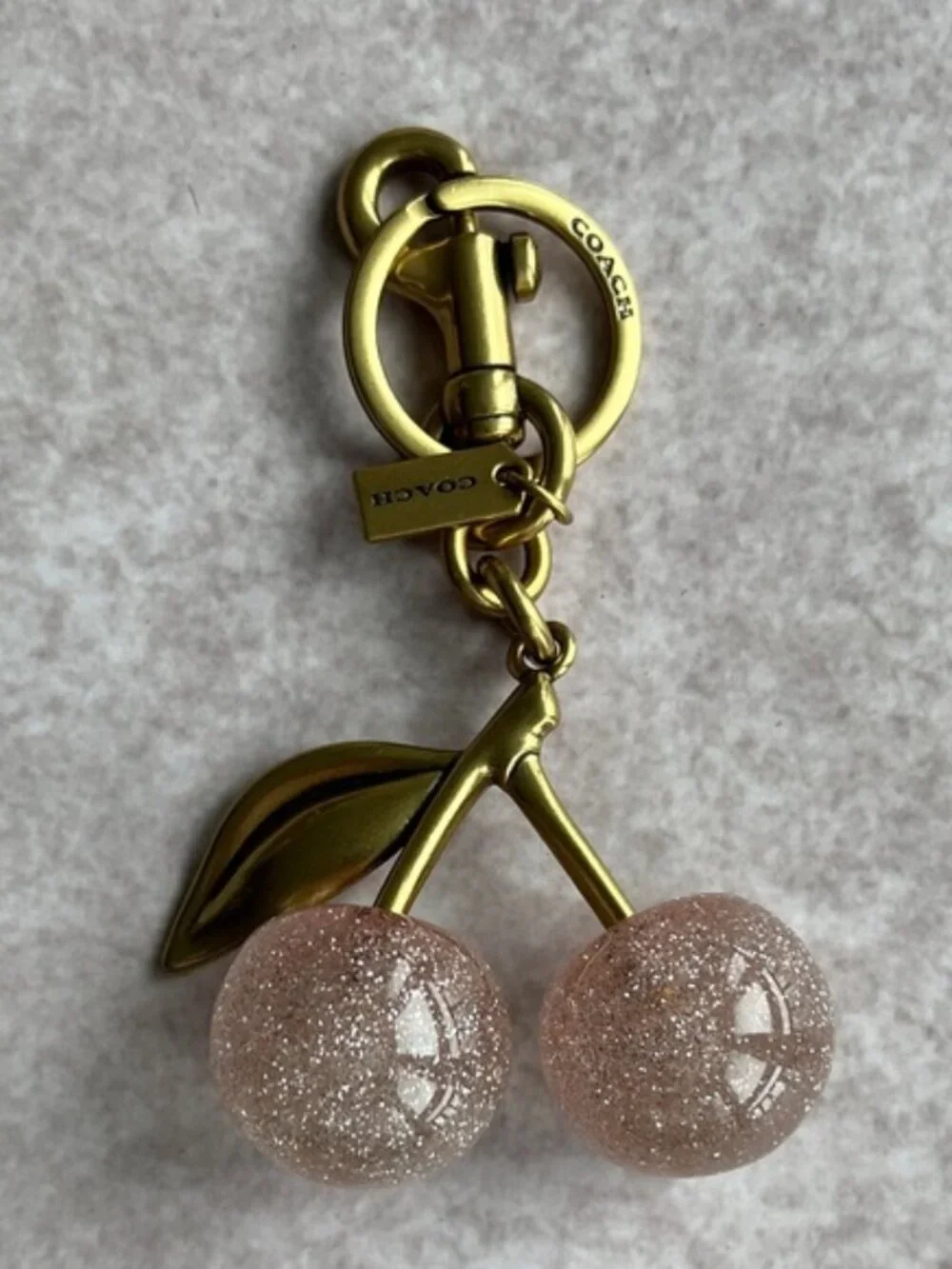 COACH Pink Glitter Cherry Bag Charm with Gold Hardware